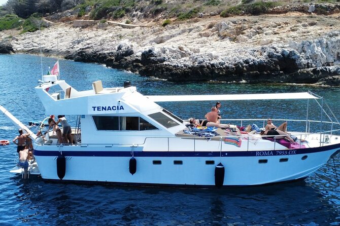 1-Day Cruise with Lunch and Snorkeling to Favignana from Marsala - The first bay stop at Scogliera Di Cala Rossa: your jump-in moment