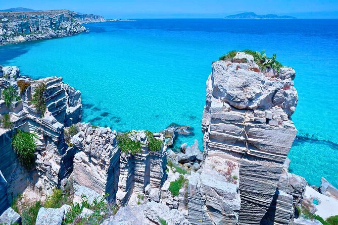 Aegadian Islands Private Tour: Favignana Levanzo with Lunch from Trapani - Cala Rossa and Grotta degli Innamorati: red rocks, Roman-Carthaginian drama, and legend