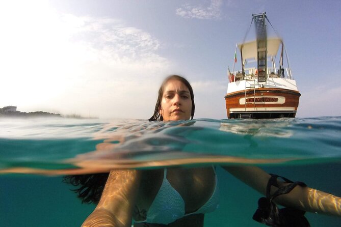 Boat excursion from Palermo with aperitif and wine - Mondello Beach stop: fine sand and snorkeling time