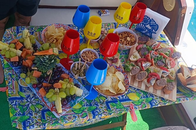 Boat Excursions Coast to Coast Cefalù with aperitif - Spiaggia Kalura: photos and a last round of sea time