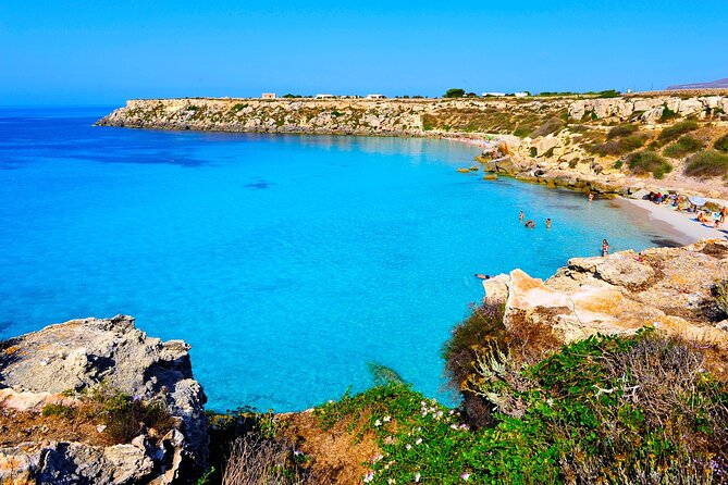 Boat tour Excursion from Trapani to Favignana and Levanzo 8 hours - Favignana swim stops: Cala Azzurra, Grotta del Bue Marino, and Cala Rossa