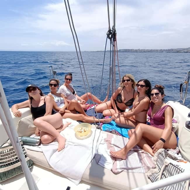 Catania: Coastline Sailing Tour with Aperitif - Sailing maneuvers and onboard comfort with music