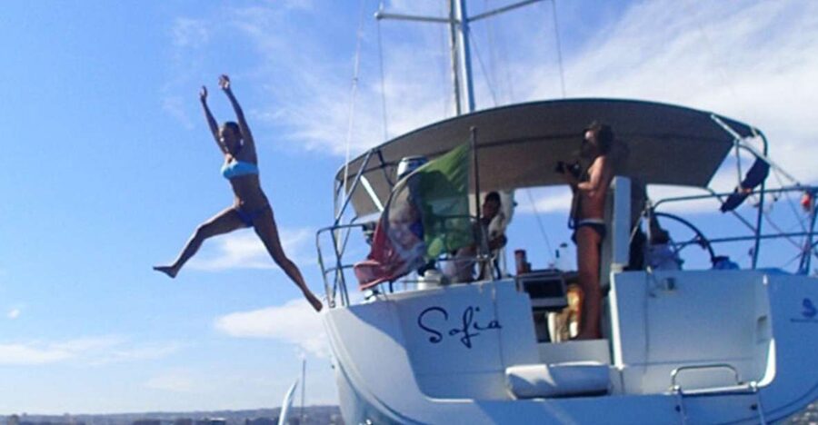 Catania: Coastline Sailing Trip with Aperitif and Prosecco - Meet the crew: skipper-led sailing with a friendly hostess vibe