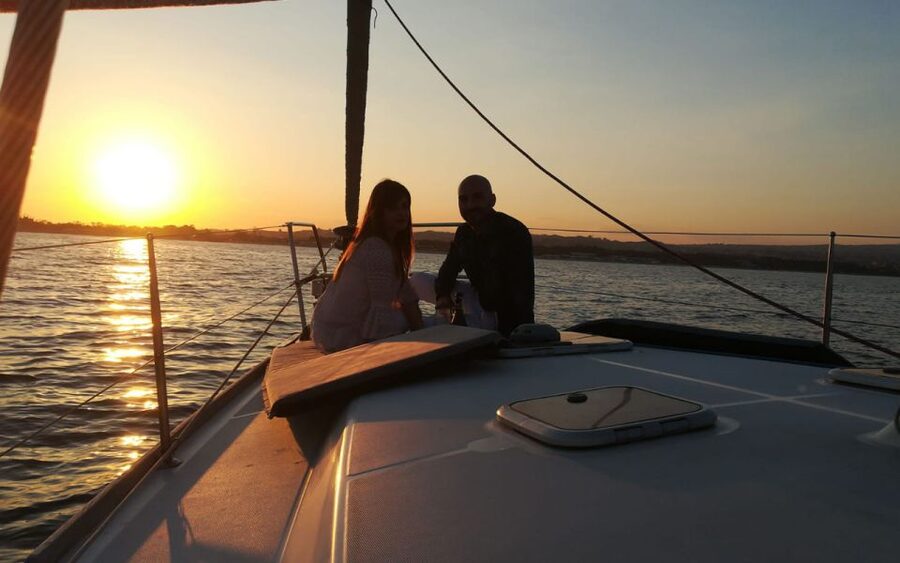 Catania: Guided Sunset Sailing Trip with Aperitif & Prosecco - Ulysses Caves Stop: Swim, or Stay Cozy and Watch