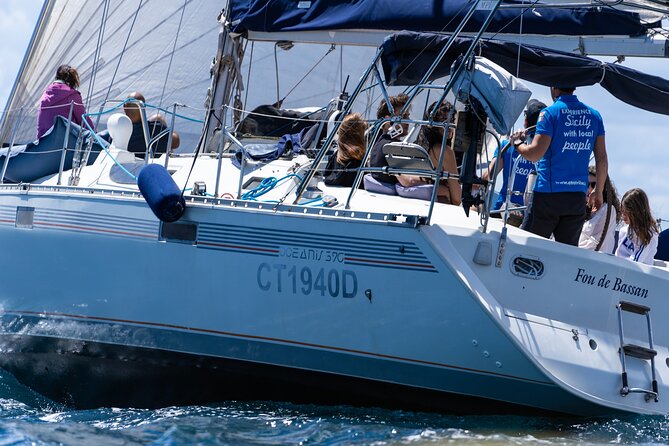 Catania: Sail Cyclops Coast by Boat and Enjoy a Sicilian Aperitif - Faraglioni di Aci Trezza: the swim stop is the payoff