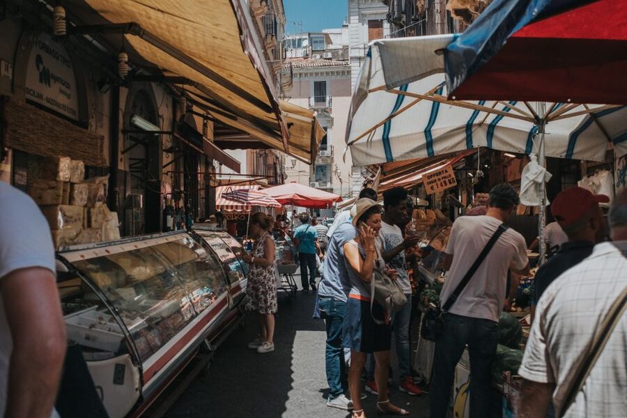Catania Street Food Tour - Market time in downtown Catania: cheeses, olives, oil, and real snacking logic