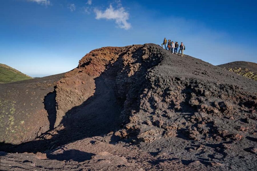 Catania: Stunning Etna Sunset Tour with Pickup and Drop-Off - Grotta Cassone cave: helmet on, flashlight on, head first