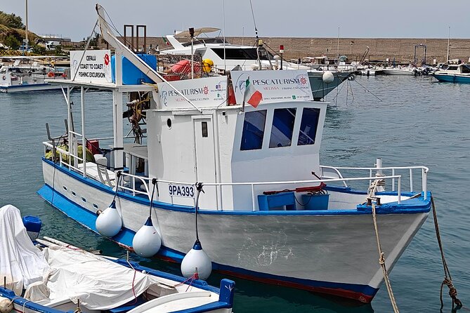 Cefalu: Boat Trip with Fishing, Coastal Tour and Lunch on Board - Net recovery and the catch: more than a photo moment
