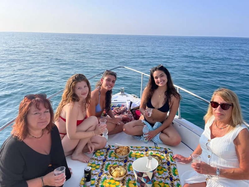 Cefalù: Mini Yacht Tour with Caves, Snorkeling, and Open Bar Aperitif - Molo di Cefalù and the boardwalk view: the coast up close