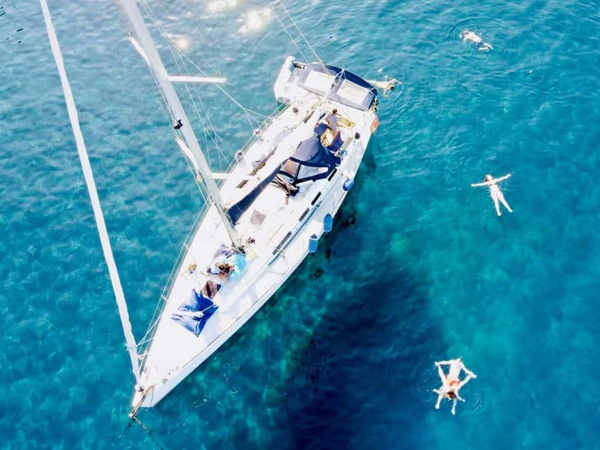Discover the magic of sailing: a boat tour in Catania - Grotte di Ulisse: snorkeling and swim time where the water is the star
