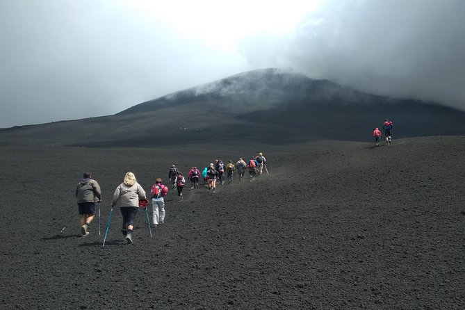 Etna: Cable Car & Hiking Tour to Summit - Descent toward the 2002 craters: volcanic sand underfoot