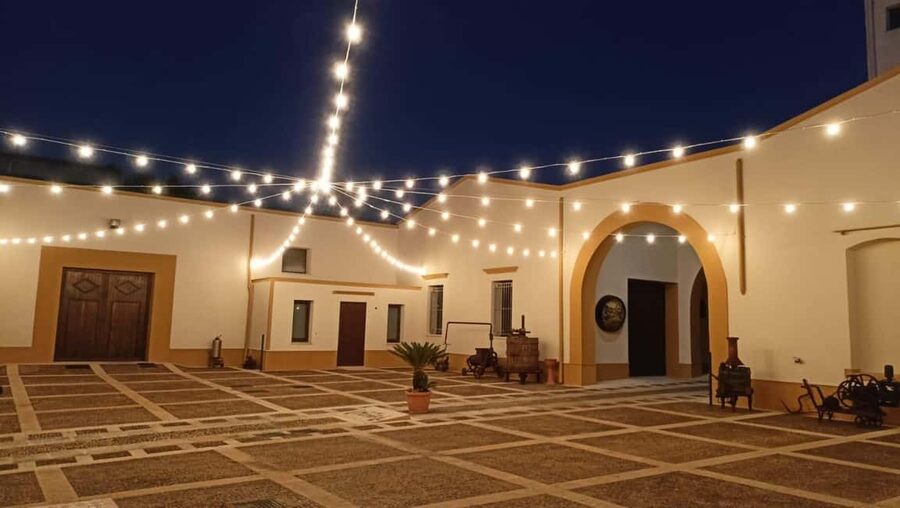 Evening tour of a historic winery and wine tasting with Sicilian cuisine - Entering the Historic Baglio Courtyard for a Real Sicilian Evening