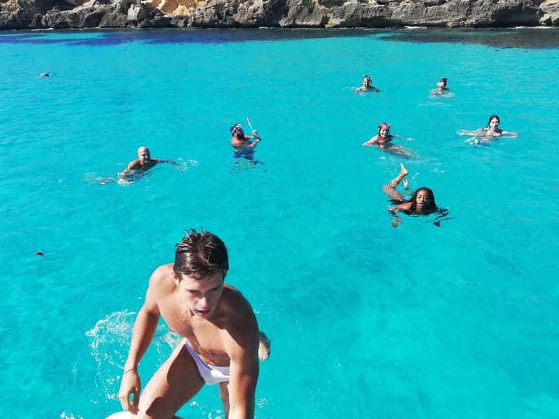 Favignana and Levanzo Boat Cruise with Lunch - Cruising back toward Favignana: Scalo Cavallo and the quarry story