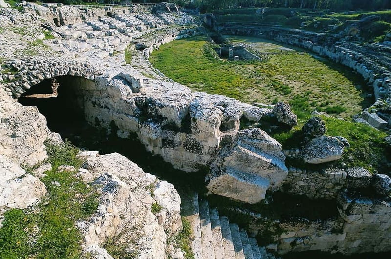 From Taormina: Guided Tour of Syracuse and Ortygia Island - Syracuse archaeological park: Greek Theater, quarries, and the Ear of Dionysius