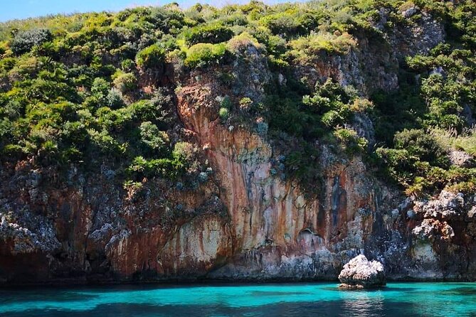 Full Day Private Boat Tour San Vito Lo Capo - Castellammare - Scopello’s La Tonnara and the Faraglioni stacks: a coastal scene with teeth