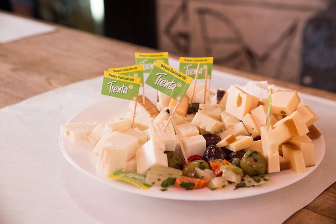 Gastronomic Street Food Tour of Catania - A’ Piscaria Mercato del Pesce: cheeses, oil, olives, and fried fish cones