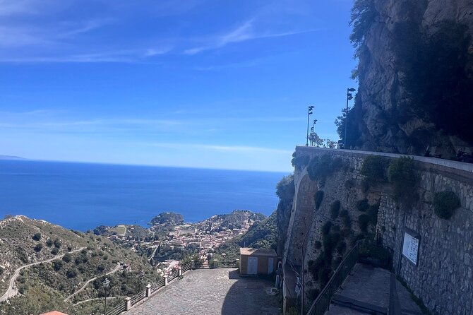 Half Day Private Tour to Messina Taormina and Castelmola - Taormina’s Corso Umberto and the balcony view toward Isola Bella
