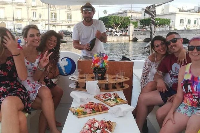 Syracuse Aperitif boat at Sunset island and sea caves - Grotta delle Stallatiti and the Prosecco in the Cave