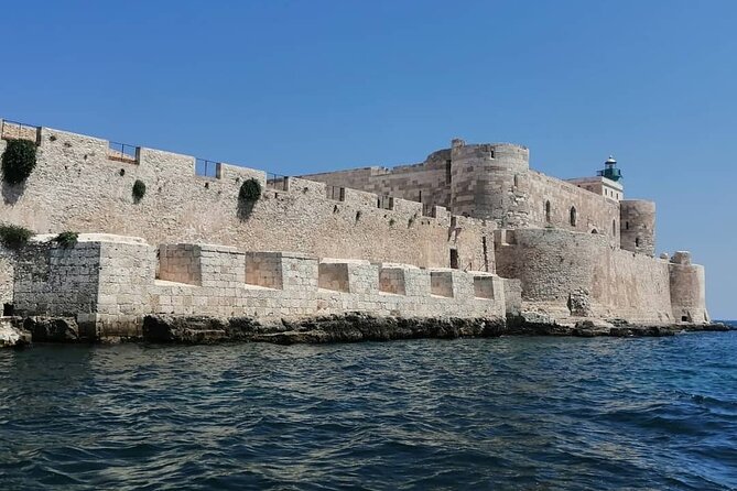 Syracuse Boat Excursion with Snorkeling to the Sea Caves - Stop 1: Isola di Ortigia swim under the castle
