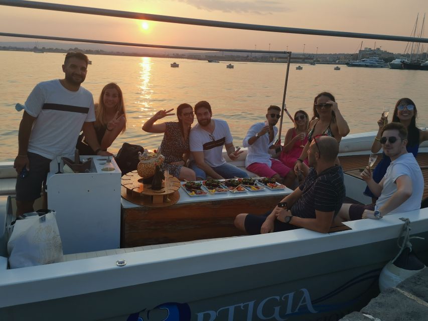 Syracuse: Ortigia Sunset Cruise with Aperitif - Swim and Snorkel Windows Near Maniace Castle and Arethusa Spring