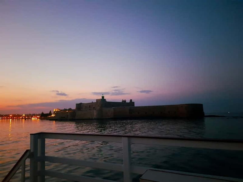 Syracuse: Sunset cruise including aperitif and swim stop - North-side Syracuse: sea caves and animal-shaped rock formations